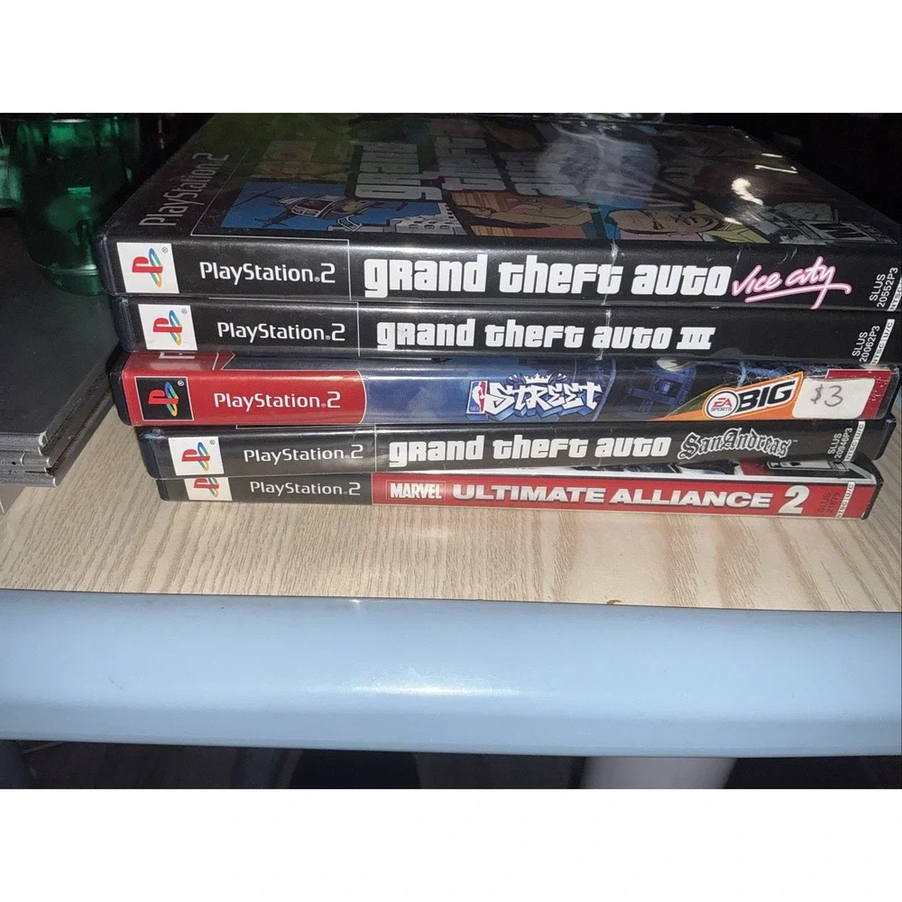 playstation 2 console,‎ 1 Wireless Controller 1 Reg Controller ,5 Games